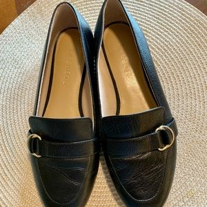 Black leather, buckle detail. Medium width, but they run a bit small.